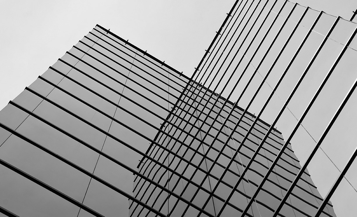 Black and white image of a glass building